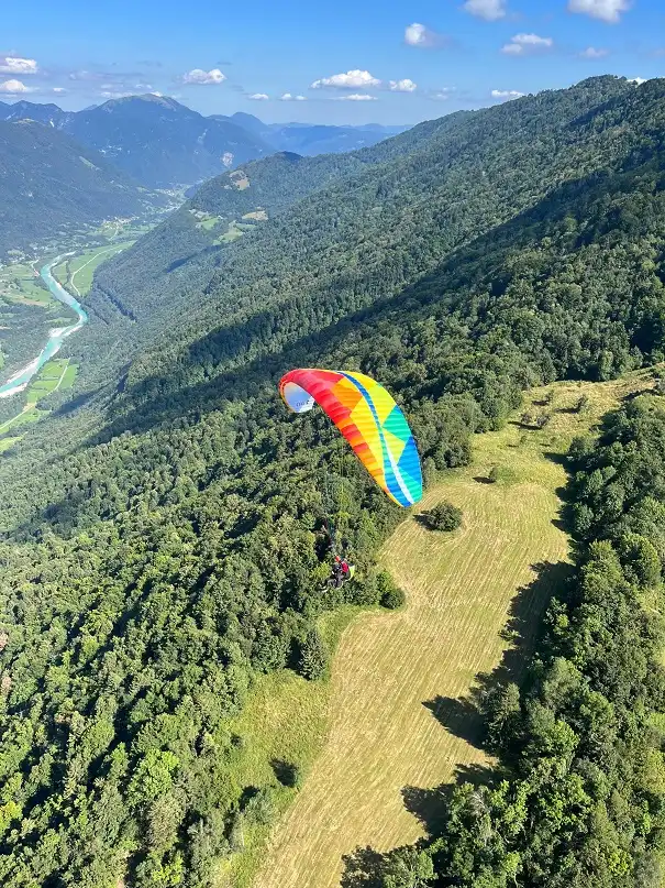 Tandem paraglider flight above the Soča Valley